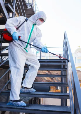 Jyoti Pest Control technician in protective gear